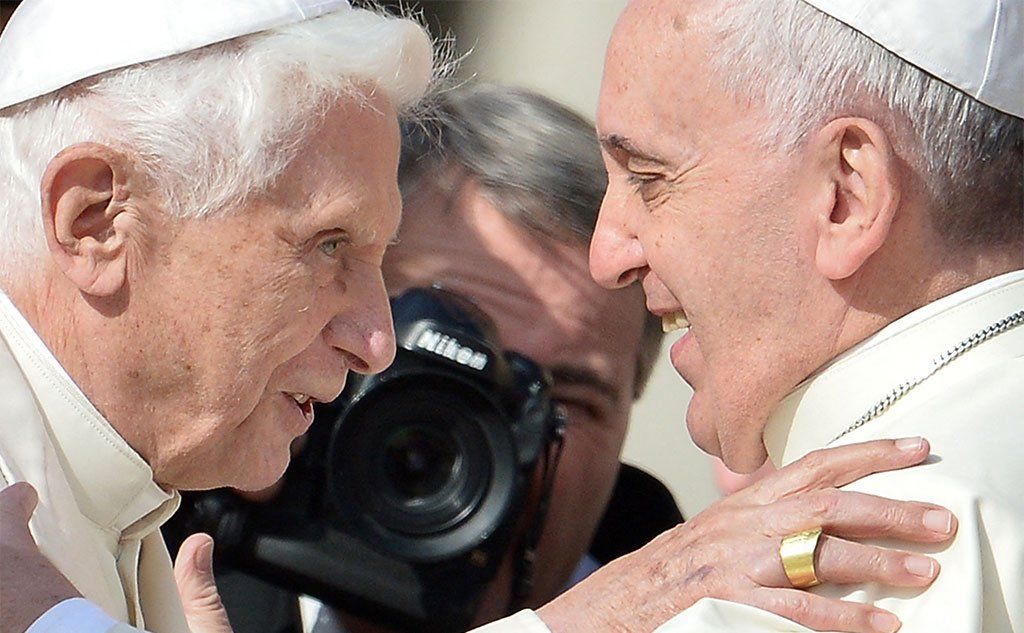 Pope Emeritus Benedict XVI is welcomed by Pope Francis at St Peter's Square, Vatican, 2014