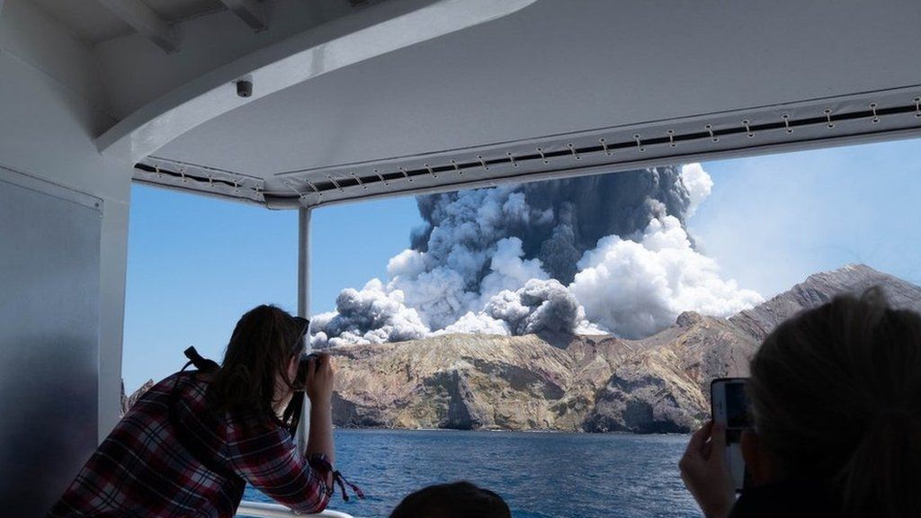 A volcano erupting on White Island.