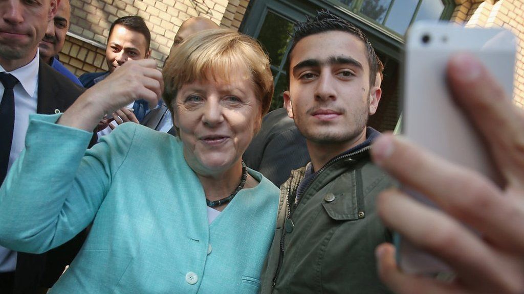 Angela Merkel poses for a selfie with a Syrian refugee in Berlin, 10 September 2015