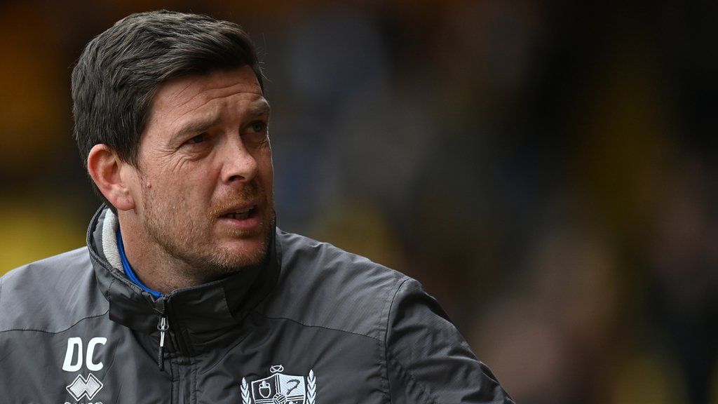 Port Vale boss Darrell Clarke looks to the stands