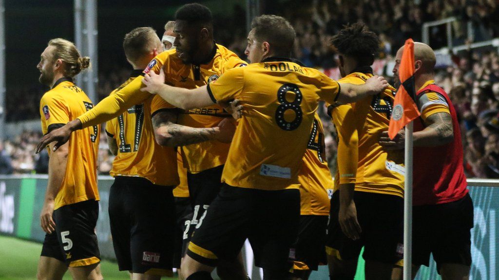 Newport players celebrate FA Cup success against Leicester in 2019