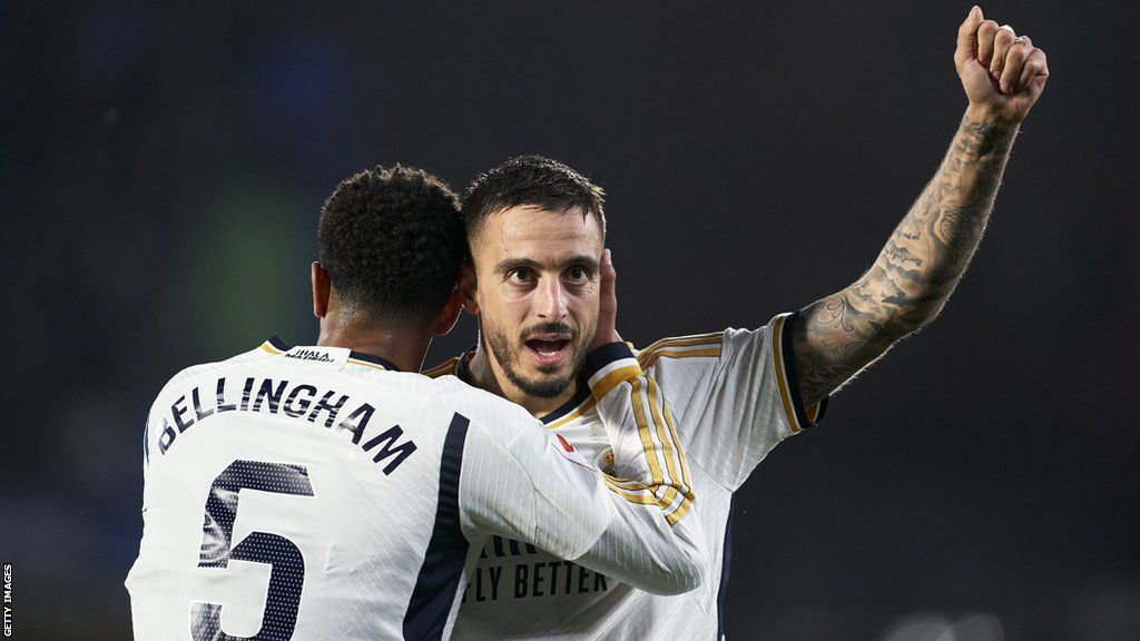 Joselu celebrates with Jude Bellingham after scoring for Real Madrid against Getafe