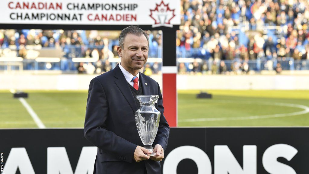 Canada Soccer president Nick Bontis prepares to hand out the MVP trophy after the 2021 Canadian Championship Final