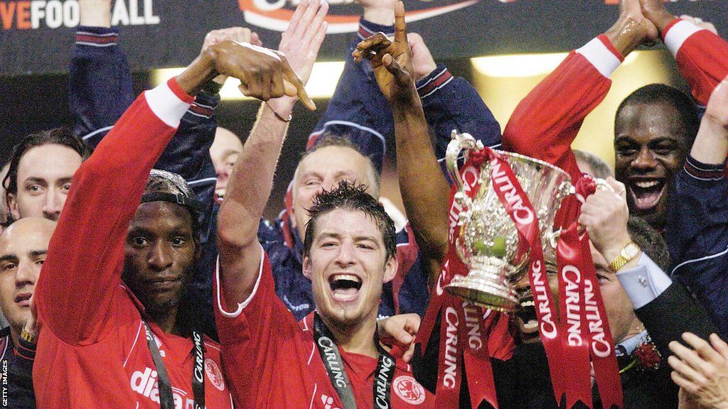 Middlesbrough players hold the League Cup aloft at Cardiff's Millennium Stadium after victory over Bolton
