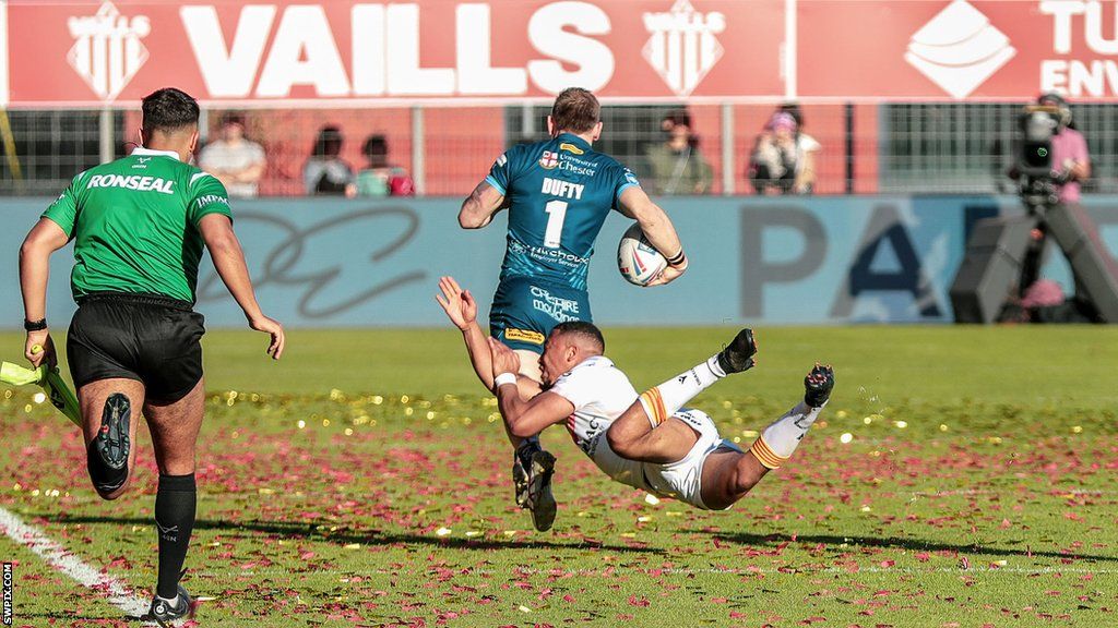 Matt Dufty sprints away from the covering Warrington defence to score a full-length try for Catalans.