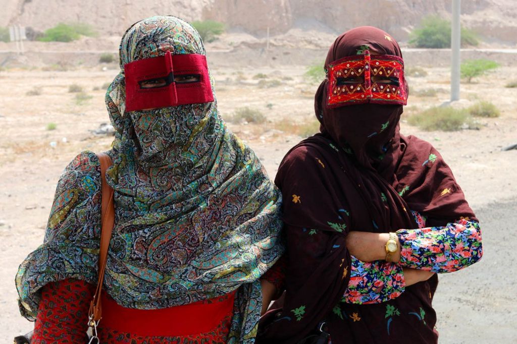 Shia Muslim Bandari women from southern Iran wearing embroidered Boregeh masks.