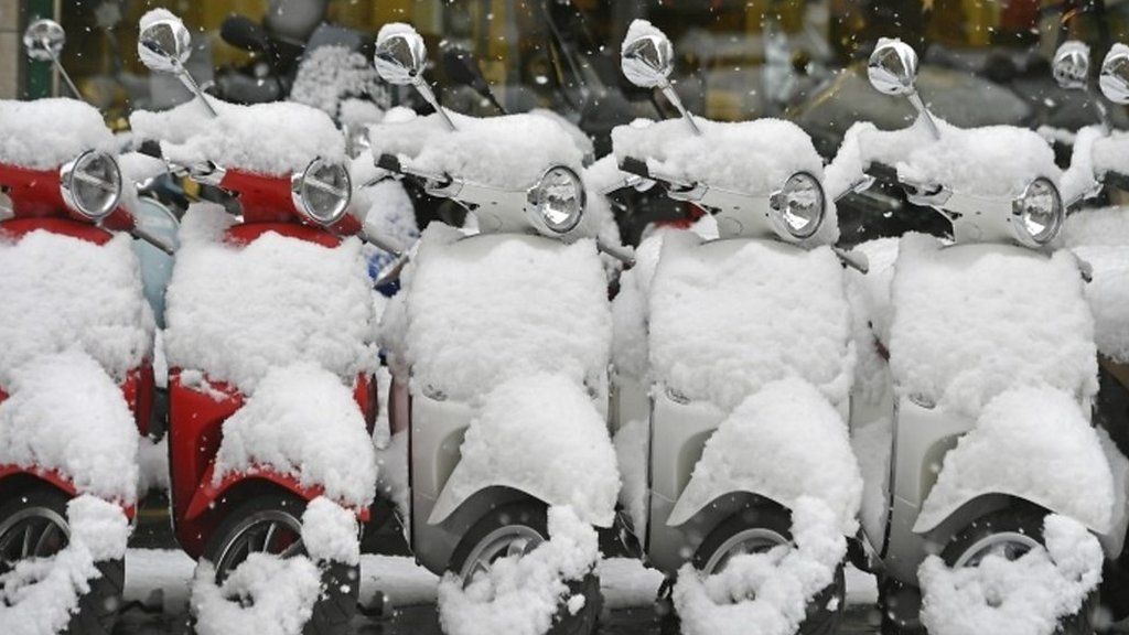 Snow on moped in Zurich