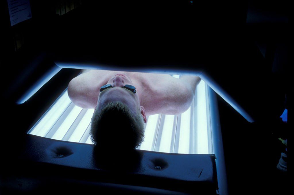 Man laying on a sunbed