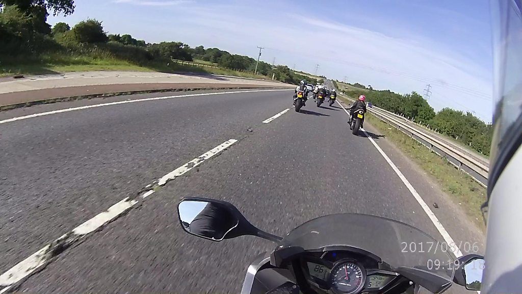 View from a police motorbike chasing speeding bikers