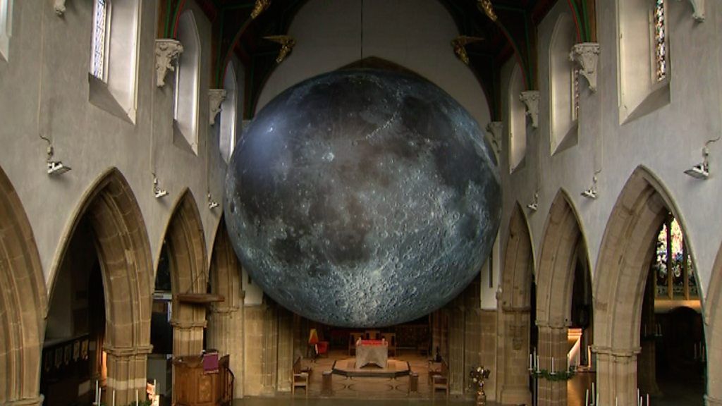 Giant moon is suspended in the nave of Leicester Cathedral