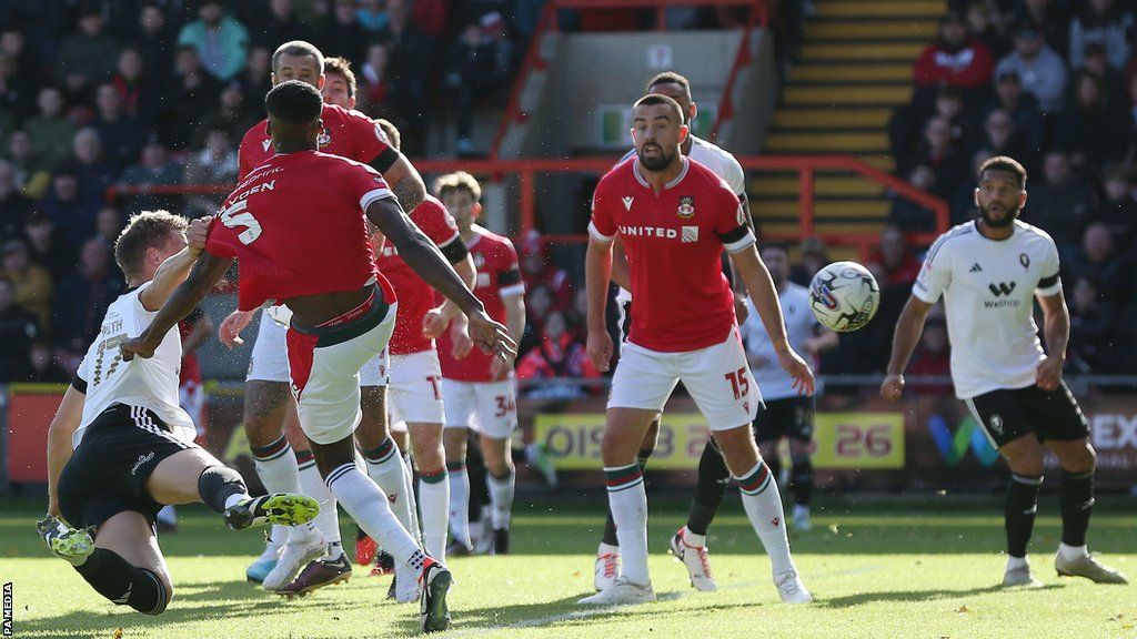 Matt Smith's diving header gave Salford an early lead at Wrexham