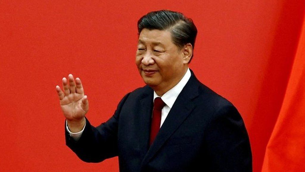 Chinese President Xi Jinping waves at the Great Hall of the People in Beijing, China