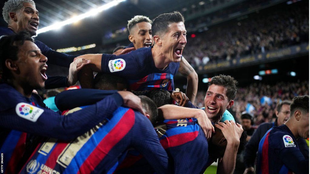Barcelona players celebrate Franck Kessie's winning goal against Real Madrid