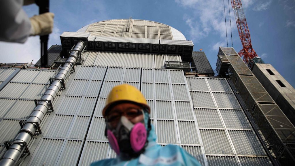 Image result for Tepco officials showed images of remote-controlled equipment lifting the fuel rods photos