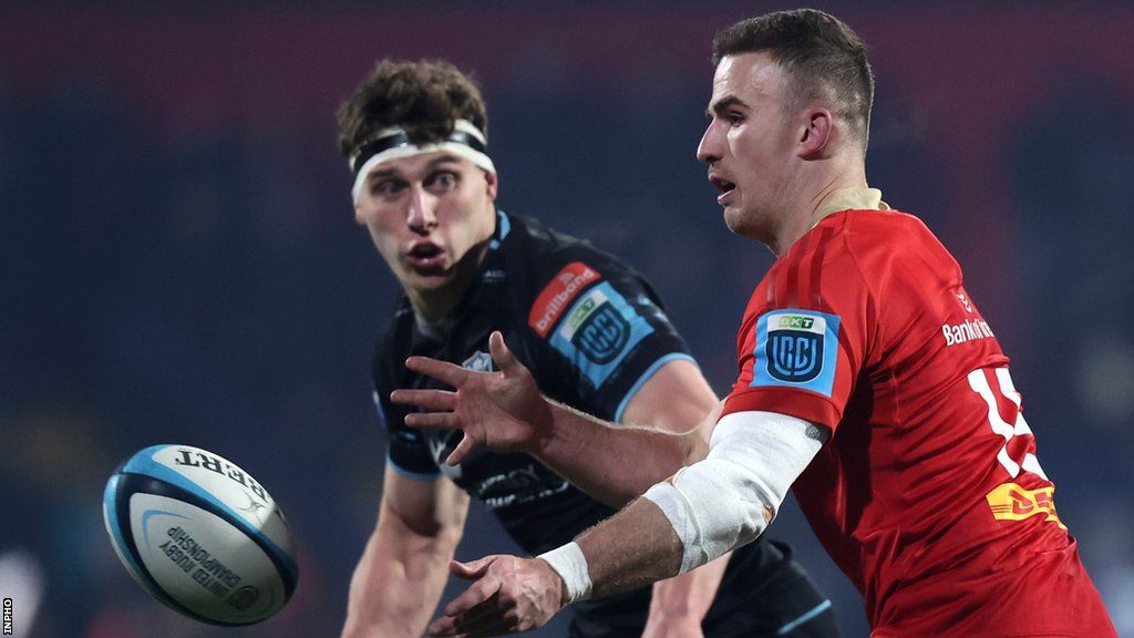 Shane Daly distributes the ball for Munster in the first half