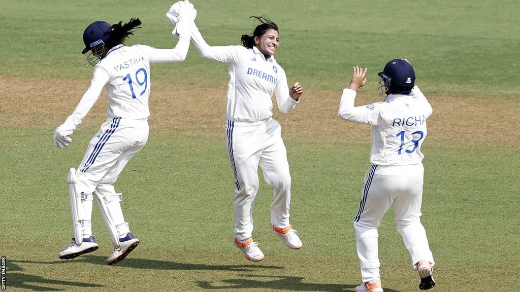 Spin bowler Sneh Rana and wicketkeeper Yastika Bhatia celebrate a wicket v England