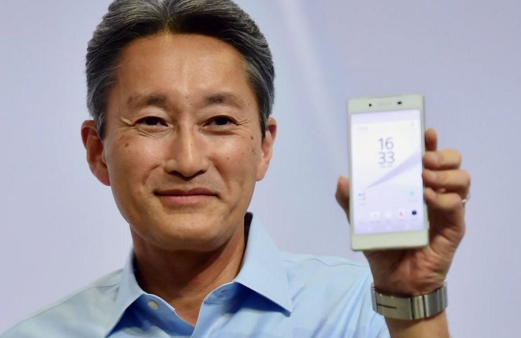 Kazuo Hirai holds up a Sony Xperia phone