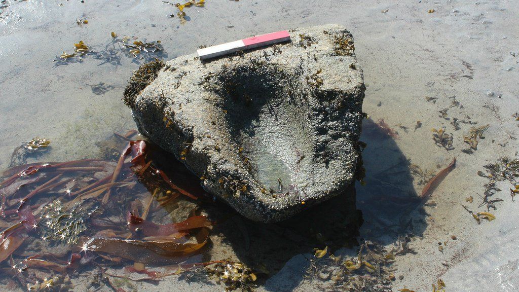 Prehistoric saddle quern in the intertidal zone