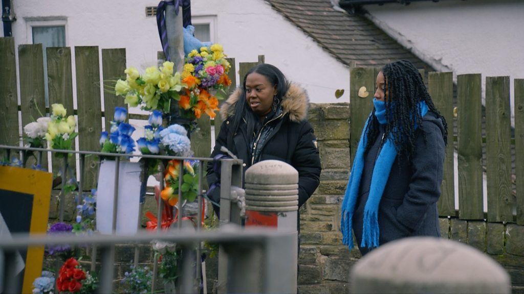 Serena and Sophie look at Khayri's memorial