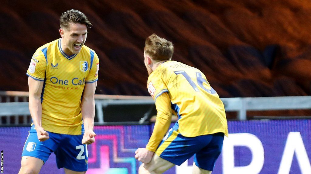 Tom Nichols (left) celebrates his goal for Mansfield against Forest Green