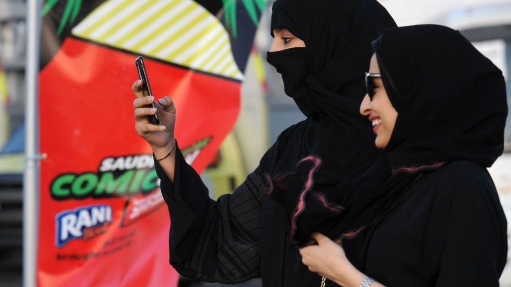 A Saudi woman uses her mobile in Jeddah on 16 February 2017