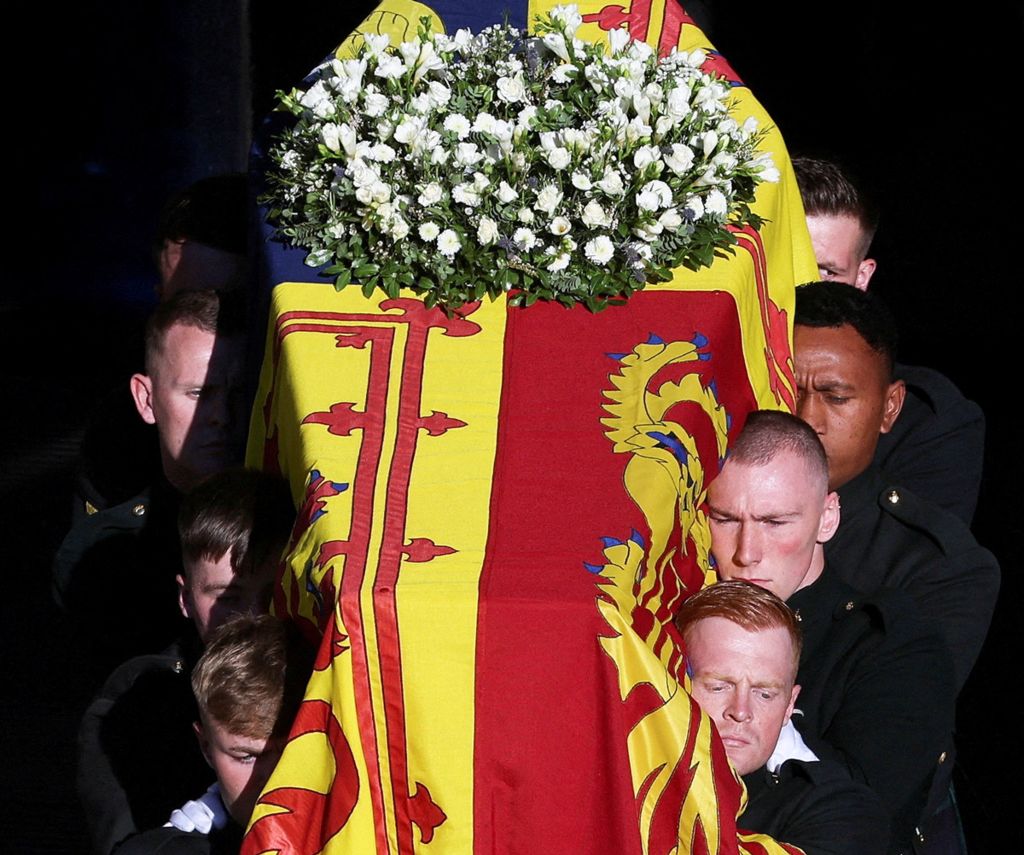Pallbearers carry the coffin of Queen Elizabeth to a hearse, outside St Giles' Cathedral, in Edinburgh