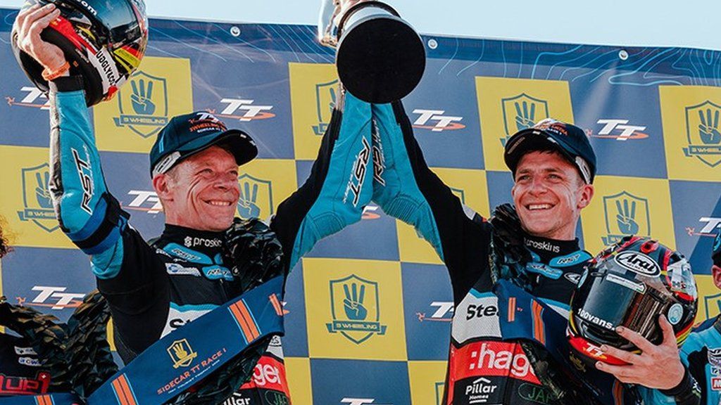 Ben and Tom Birchall with the TT trophy