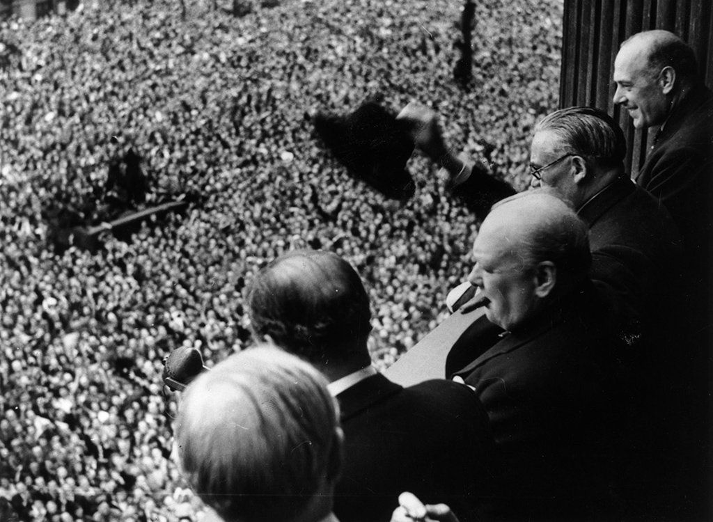Prime Minister Winston Churchill addresses a huge crowd from a balcony in the Ministry of Health building on VE Day, 8 May 1945