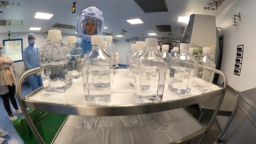 Lab technicians looking at bottles