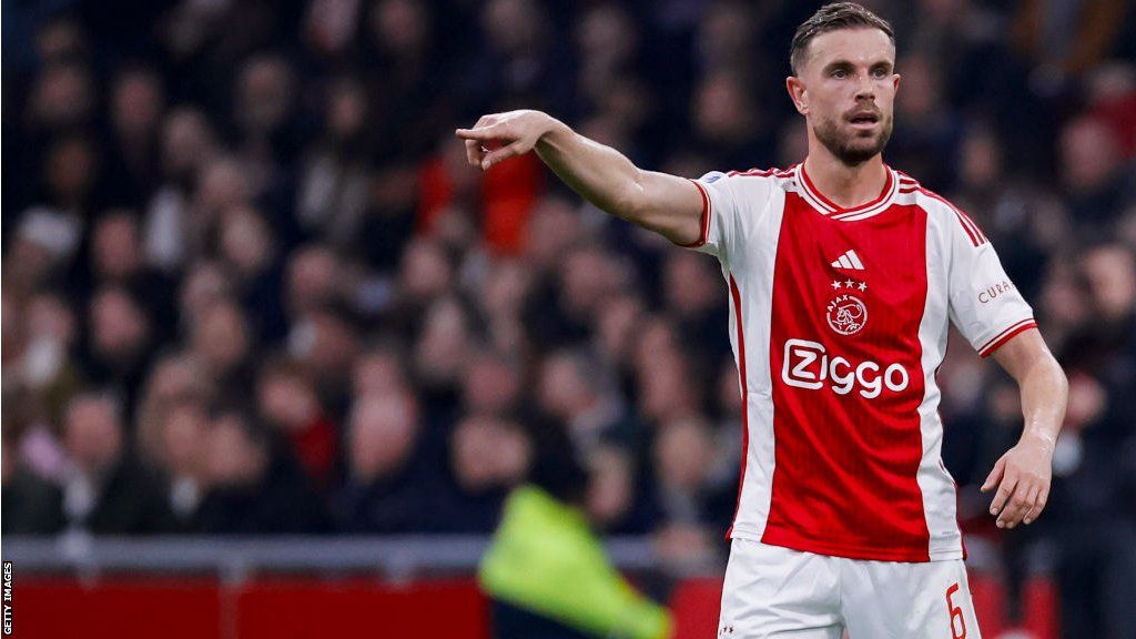 Jordan Henderson points during his Ajax debut