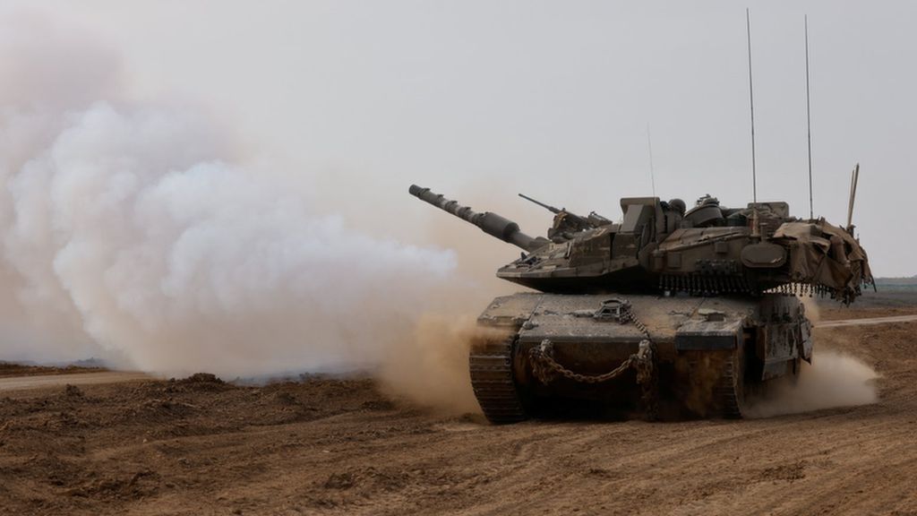 An Israeli tank returns from the southern Gaza strip, in southern Israel, February 26, 2024