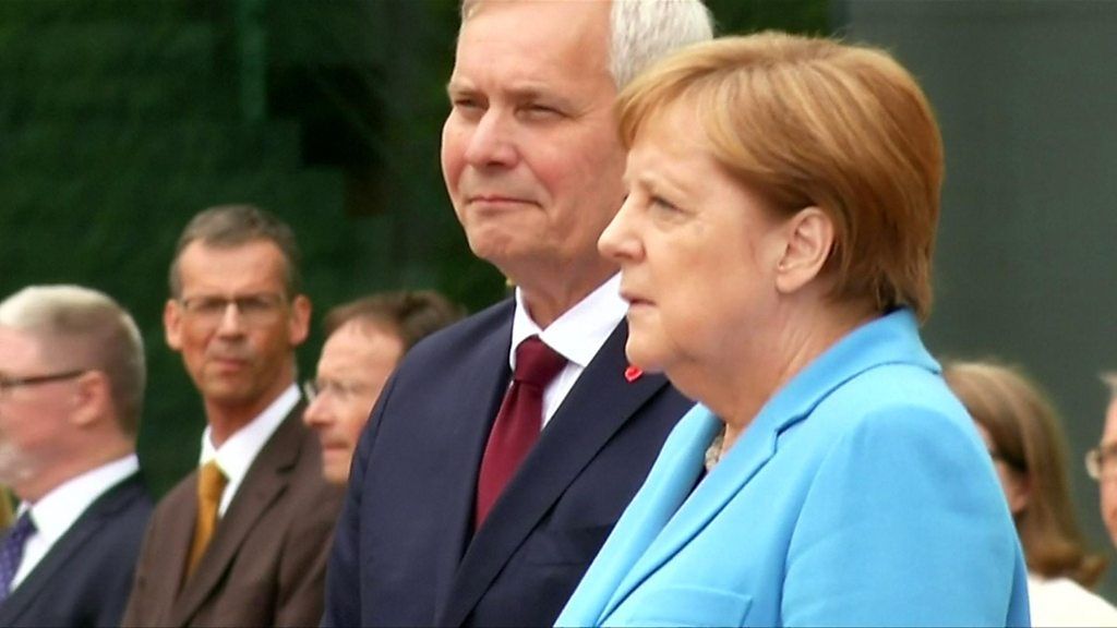 Angela Merkel seen shaking in Berlin