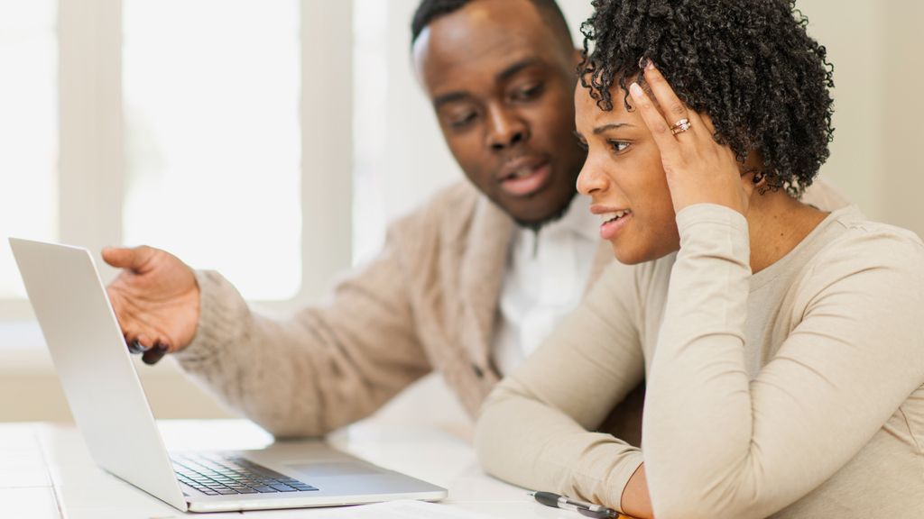 Young couple looking at laptop