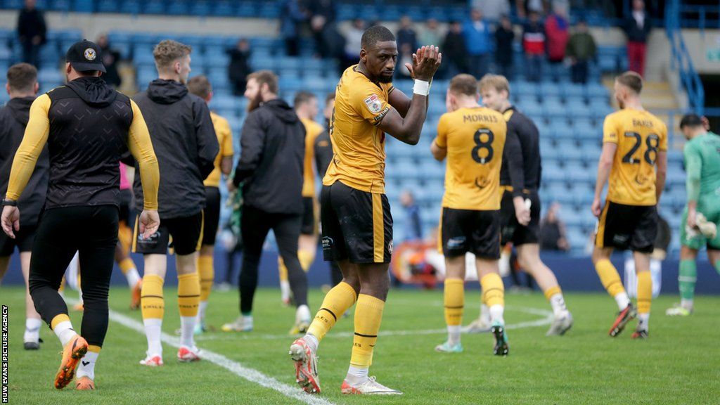 Newport striker Omar Bogle applauds his own fans after the 2-0 win at Gillingham in which he scored both goals