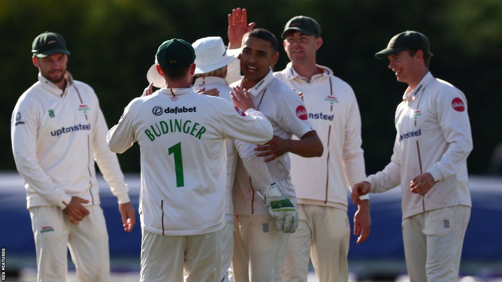 Leicestershire players celebrate a Derbyshire wicket
