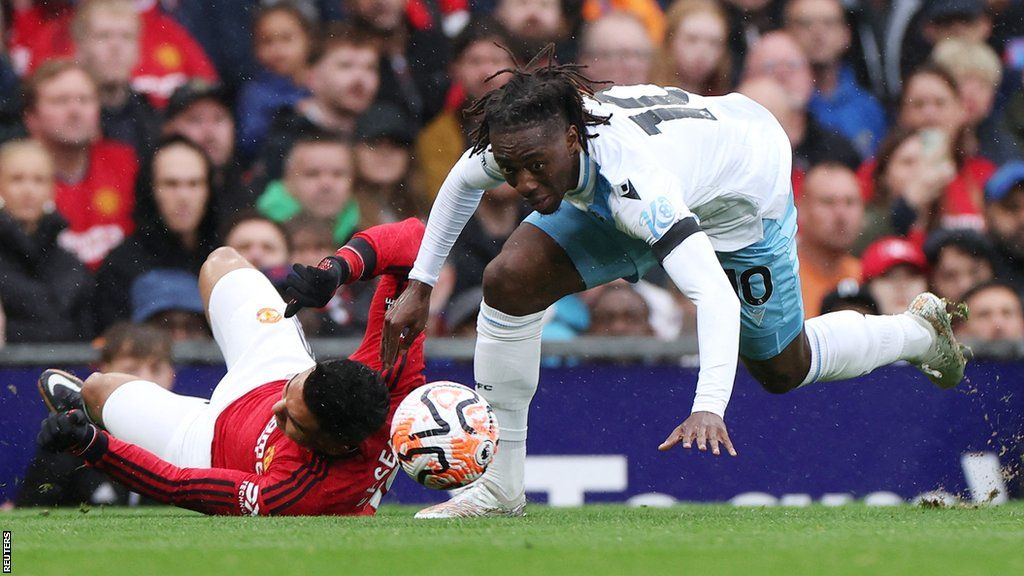 Crystal Palace midfielder Eberechi Eze has his eye on the ball as he falls to the ground during his side's 1-0 Premier League win at Manchester United in September