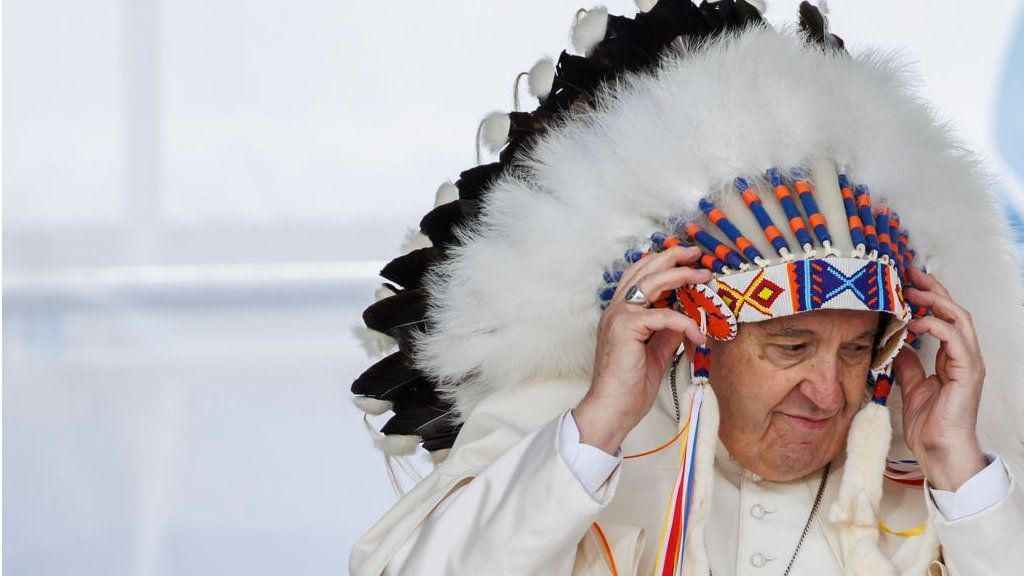 Pope Francis wears a traditional headdress that was gifted to him by indigenous leaders during his visit on July 25, 2022 in Maskwacis, Canada.
