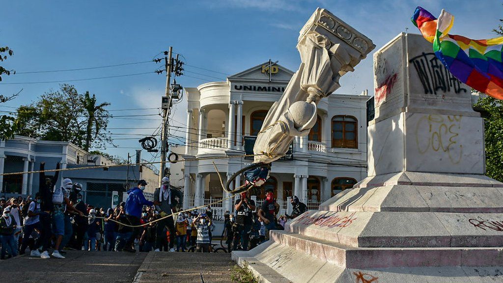 rotestors topple a statue of Christopher Columbus during a demonstration against government in Barranquilla, Colombia on June 28, 2021.