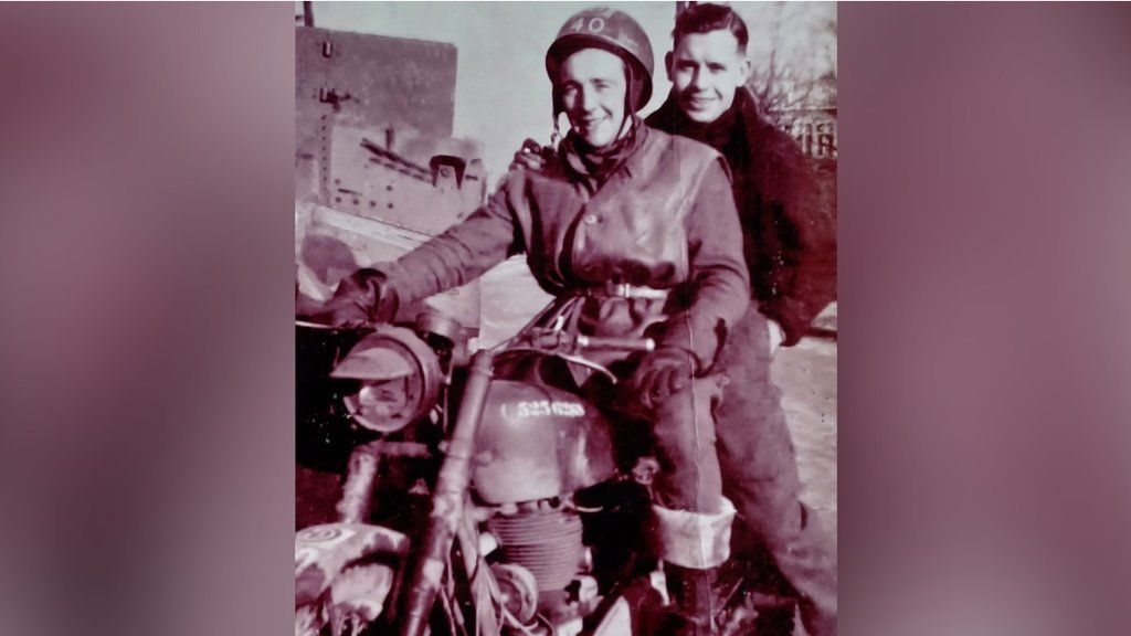 A black and white photo of Don Sheppard on a motorbike with one other man riding pillion