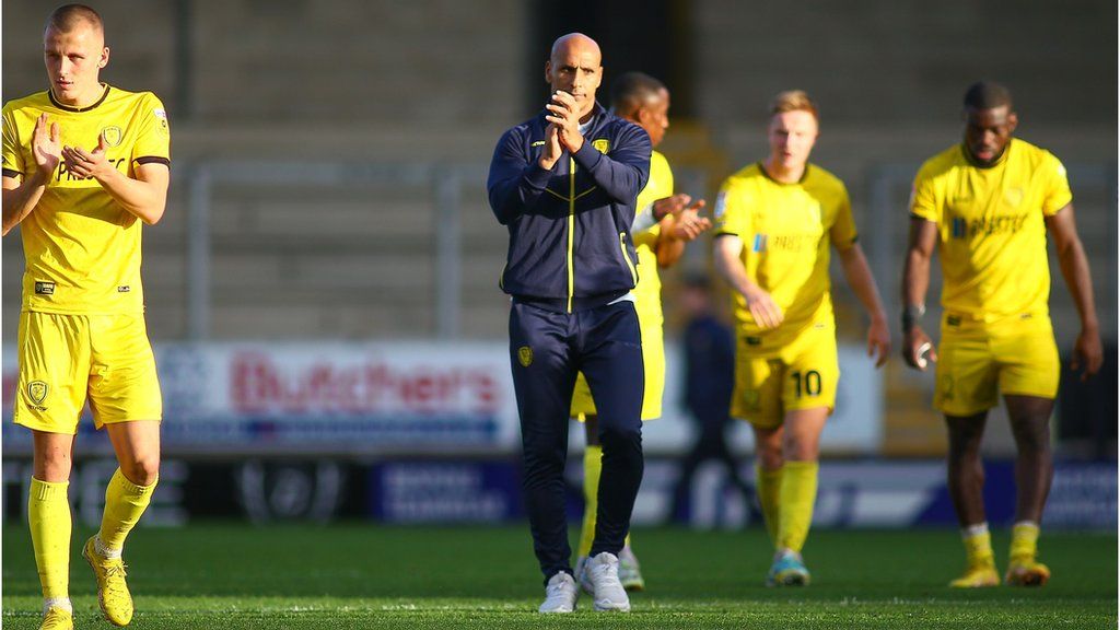 Dino Maamria on the pitch with his Burton players