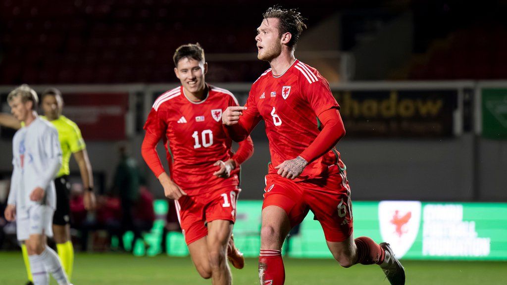 Joe Low celebrates after scoring for Wales Under-21s against Iceland