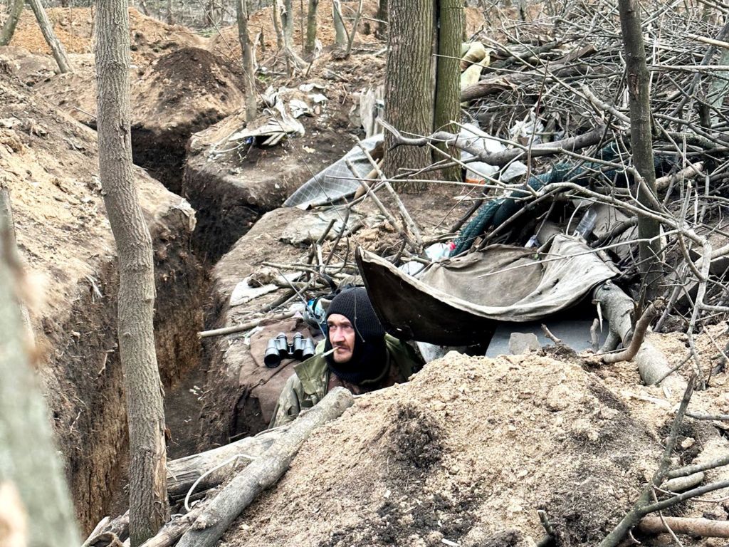 Ukrainian soldier in a trench