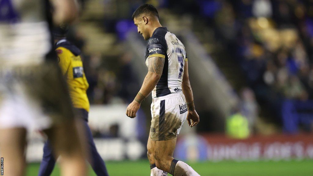 Fa'amanu Brown walks off after his red card for Hull against Warrington