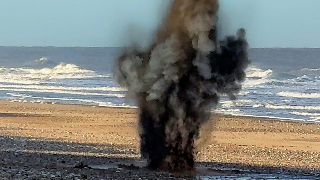 Shell is detonated on a Norfolk beach.