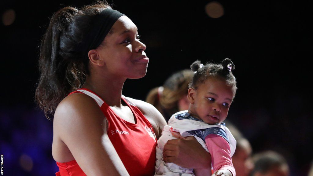 Eboni Usoro-Brown of Team England is seen with her daughter after the bronze medal match between England and New Zealand