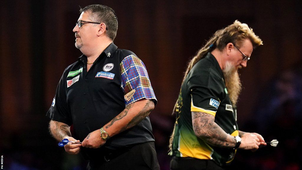Gary Anderson and Simon Whitlock in darts action at the PDC World Championship