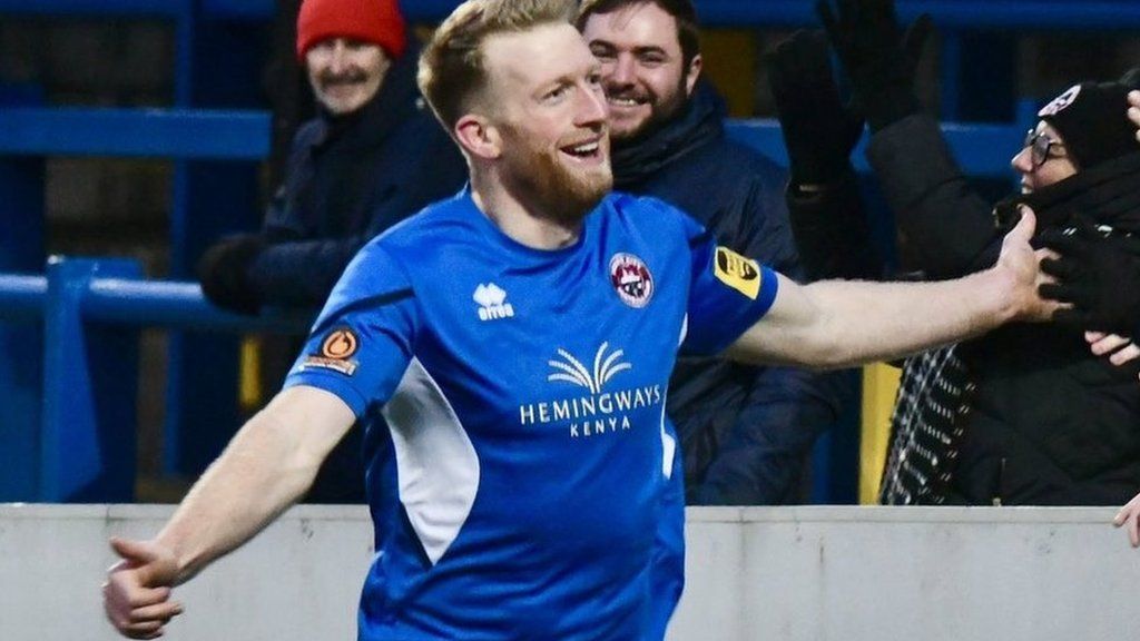 Ed Palmer celebrates scoring