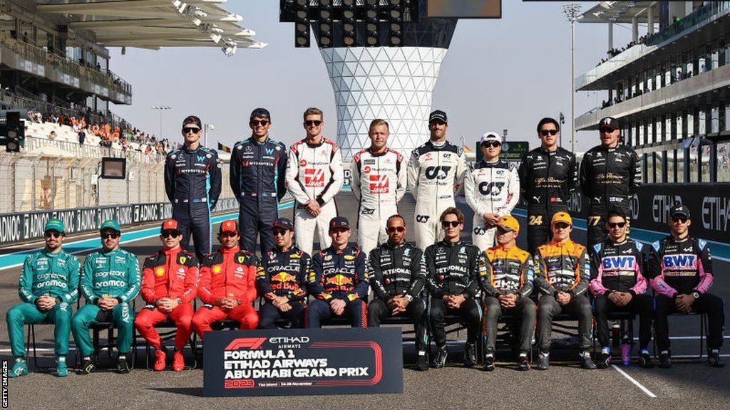 all 20 drivers line up for a picture after the 2023 season