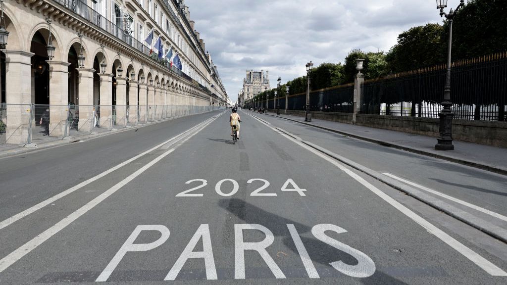 A woman rides up a cycle lane in Paris