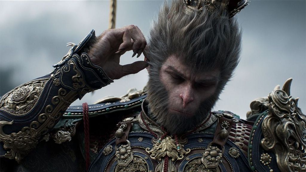 A humanoid ape character in elaborate armour puts its hand to its ear and looks pensively at the ground.